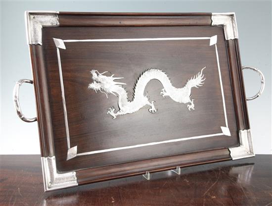 A Chinese hongmu and silver mounted dragon tray, early 20th century, width 64.5cm